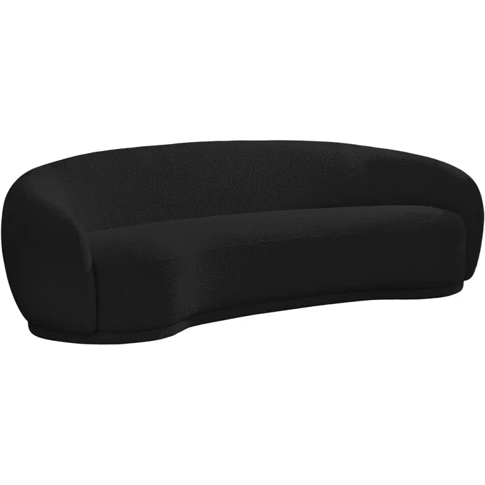 Curved black boucle sofa