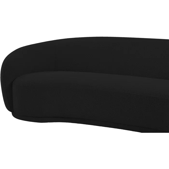 Curved black boucle sofa